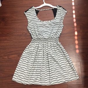 Black and white patterned lacy back dress.